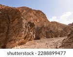 Small photo of Golden Canyon trailhead with scenic view of colorful geology of multi hued Amargosa Chaos rock formations, Death Valley National Park, Furnace Creek, California, USA. Barren Artist Palette landscape
