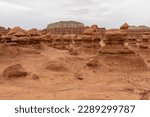 Small photo of Scenic view on amazing eroded Hoodoo Rock Formations at Goblin Valley State Park in Utah, USA, America. Sandstone rocks called goblins which are mushroom-shaped rock pinnacles. Overcast day in summer