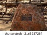 Small photo of Superior, AZ, USA - May 2022: statue plaque at Boyce Thompson Arboretum that says if we follow him home can we keep him pa