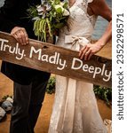 Small photo of Truly. Madly. Deeply sign on wood