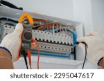 Electrical measurements with a multimeter tester. industrial electricity Test the voltage on the automatic control box using a digital voltmeter. electrical control panel circuit breaker background