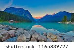 Good mornig Lake Louise.  {Panoramic view of the world famous Lake Louise from shore line to Victoria Glacier.  From the boat rental house to the shore the Chateau Lake Louise.