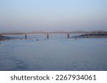 Small photo of Varanasi Utter pradesh India 09 Feb. 2023 View of a Ghat of sacred river Ganges in Varanasi or Banaras Malviya Bridge in the background, india