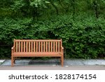 a wooden bench installed in the park