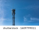 A single standard cell site tower in Canada. A steel frame tower houses electronic communications equipment. Telecommunications infrastructure