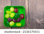 Small photo of Multi-colored lollipops. Lollipops close-up. Fruit lozenges. Natural caramel lozenges.