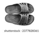 Small photo of Rubber black slippers on a white background. Rubber slippers, black slippers.