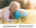 Child With Earth Globe....