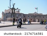 Small photo of Taranto, Italy - July 9, 2022: Donadonibus Pier Frabrizio riding the historic 1956 Lambretta D150 at the last kilometer launched before the finish line of the 35th Milan-Taranto race.