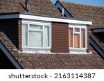 Small photo of Dormer windows in a 1970s chalet bungalow with tiled roof
