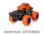 Small photo of Bigfoot toy car isolated on white background, of toys for boys big wheels
