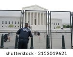 Small photo of Washington, DC â€“ May 05, 2022: Policemen guard the Supreme Court building as they prepare for upcoming demonstrations regarding the likely court decision making abortions illegal under the law.