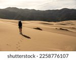 Woman Leaves Footprints on the Surface of Great Sand Dunes National Park