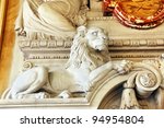 Magnificent sculpted lion part of a marble fireplace mantle of an historical european building, hotel de ville de Lyon, France.