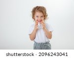 A little cute girl holds a jug...