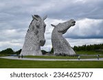 Small photo of Falkirk , United Kingdom - July 5, 2023: The Kelpies horses statue by Andy Scot, Helix park, Scotland.