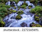 River waterfall on mossy stones....