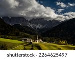 Peaks of the Odle group with village St. Magdalena in autumn, Villnößtal, St. Magdalena, South Tyrol, Italy