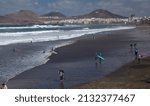 Small photo of Las Palmas de Gran Canaria, Las Palmas, Spain, February 02 2022: Surfers and other users of Las Canteras beach are faced with cool termperature and stormy ocean, consequences of storm Eunice