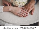 the hands of the newlyweds. Golden ring for bride and groom. wedding,