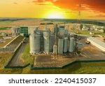 Silo storage at farm. Elevator for storage siliage and grain. Feed Silos Hopper for storage of wheat and barley. Grain drying in agro plant. Silos granary elevator. Processing manufacturing plant.