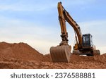 Small photo of Excavator on earthmoving. Open pit mining. Backhoe dig ground in quarry. Heavy construction equipment on excavation on construction site. Excavator on groundwork foundation. Excavation contractors