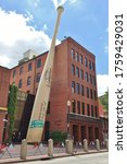 Small photo of LOUISVILLE, KY -30 MAY 2020- View of the Louisville Slugger Museum & Factory, a baseball bat museum attraction located in the West Main District of downtown Louisville, Kentucky, United States.