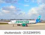 Small photo of MIAMI, FL -13 MAR 2022- View of an airplane from Frontier Airlines (F9) with a Mia the Dolphin livery at the Miami International Airport (MIA), formerly Wilcox Field.