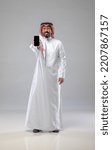 Small photo of A saudi character holding the phone on withe background