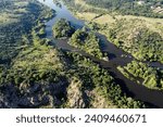 Winding bed of the Southern Bug river. River, landscape from a bird's eye view. Rough, rocky terrain.
