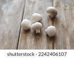Mushrooms Champignons Lie On A...
