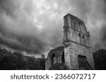 Roche Abbey ruins near Maltby in South Yorkshire. Dramatic sky, spooky and atmospheric in black and white.