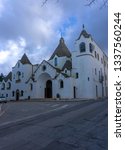 Small photo of Alberobello, Italy - 14.02.19: View of the Church of Sant'Antonio di Padova, known as the Hammer of the Heretics, built for 14 months in 1927 using the same traditional technique as for the trullo.