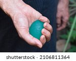 Southeast asian, Chinese old man gripping hand exercise elastic ball.