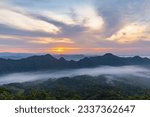 Panorama landscape with of stunning view in early morning with sunrise and fog over the big mountains, View point from the top of Doi Fah Ngam (Fah Ngam Mountain) Chae Hom District, Lampang, Thailand.