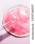 Small photo of Cosmetics drop macro on pink background. Beauty serum gel texture swatch. Moisturizer lotion, fluid swash. Liquid makeup product closeup. Cosmetic product laboratory test. Scientific cosmetology