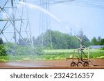 Small photo of Irrigation equipment, irrigation truck on the freshly sown field. Agricultural field irrigation, Irrigation system for irrigating crops, waters the freshly sown field.