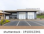 Small photo of Rugby, Warwickshire, UK - February 5th 2021: Closed Debenhams store in Elliott's Field retail park. In front of the store is a deserted car park.