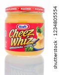 Small photo of Winneconne, WI - 19 November 2018: A jar of Kraft Cheez Whiz original cheese dip on an isolated background.