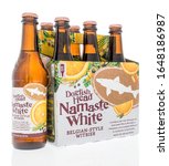 Small photo of Winneconne, WI - 16 February 2020: A six pack of Dogfish head namaste white beer on an isolated background.