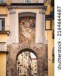 Small photo of The ancient city gate of San Gennaro, Naples, Italy, with the seventeenth century fresco by the Baroque artist Mattia Preti.