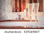Two glasses of champagne near jacuzzi. Valentines background. Romance concept. Horizontal, toned