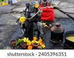 Small photo of Shani Dev Hindu God Statue in Grand Bassin or Ganga Talao, Mauritius with Flower Offering or Sacrifice