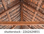 Ancient wooden roof structure and roof tiles of Asian temples.