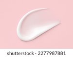 cosmetic smears cream texture on pink background