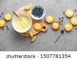 Tartlets with custard and blueberry, top down view, blank space for a text