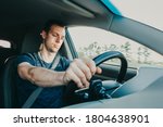 Small photo of Tired driver falls asleep while driving car. Sleepy man wearing seat belt in vehicle. Risk of accident due to alcoholic intoxication. Unsafe driving from fatigue or drunkenness.