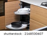 Kitchen access mechanism Magic corner for Blind Corner Cabinets. Solution for a kitchen corner storage in cupboard. Corner unit with pull out shelves for cookware.
