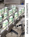 Small photo of Bucharest/Romania - June 18 2014: Industrial yoghurt packaging line at Danone Romania factory in Bucharest. The Groupe Danone is a French food-products multinational corporation.