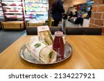 Small photo of Manchester, UK - Dec. 07, 2021: A sandwich, juice and other freshly made organic fast food products at a Pret a Manger chain store at Manchester airport